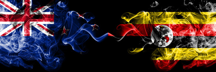 New Zealand vs Uganda, Ugandan smoky mystic flags placed side by side. Thick colored silky abstract smoke flags