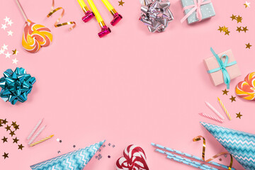 Birthday party decoration frame on pink background. Top view. Copy space.