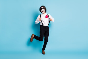 Full length body size view of his he handsome creepy cheerful cheery gentleman guy having fun pulling suspenders dancing theme event isolated bright vivid shine vibrant blue color background