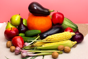 Healthy food photo. Ripe vegetables raw eating. Vegan vegetarian products. Lose weight diet. Harvest thanksgiving theme. Pumpkin, corn, cucumber, tomato, walnuts, eggplant, onion, garlic vegs.  