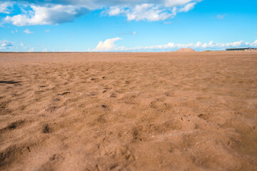 Fototapeta na wymiar Sand and blue sky, beautiful empty landscape