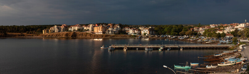 Fototapeta na wymiar Early in the morning, before a storm. Panoramic view of the pier, Black Sea.