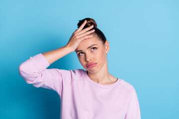 Photo of frustrated sad girl pessimist touch hand forehead feel exhausted about work job education problems wear good look up copyspace pullover isolated blue color background