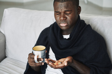 Man with medicines in his hands cold headache discontent 
