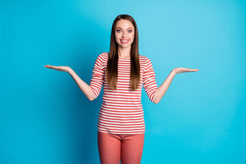 Photo of positive cheerful girl promoter hold hand demonstrate compare measure adverts promo wear...
