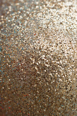 Shiny background. Gold with silver with highlights and bokeh. Christmas.