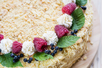 Napoleon cake with raspberries and cream. Selective focus, close-up