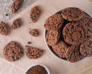 Chocolate Cookies served on white bowl with scattered cookies on the side