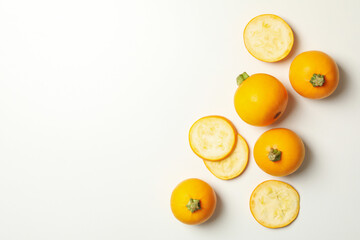 Round zucchini and slices on white background, top view