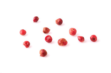 dried pink peppers isolated on white