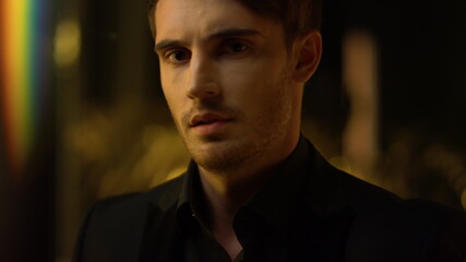 Ambitious top manager straightening jacket. Confident man throwing head back.