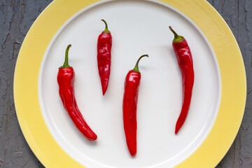 Sweet red bell peppers – capsicum annuum – drying on a plate in preparation for freezing.