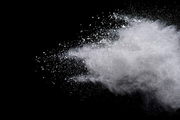 Freeze motion of white color powder exploding on dark background. 