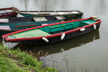 Fototapeta na wymiar Typical hobby fishing boat at a mooring in a river.