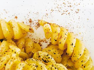 close-up view of cooked fusilli pasta seasoned with spices, paprika and pepper