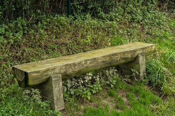 A very rustic sitting bench awaiting sitters.