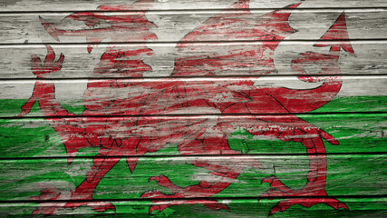 Wales flag painted on weathered wood planks