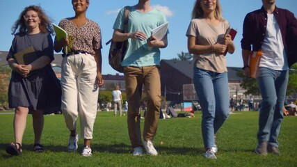 Group of diverse college students spending time together on campus at university yard. - Powered by Adobe