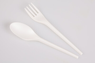 paper napkin Plastic Cutlery set with Fork, Knife and Spoon isolated on white background sealt pepper