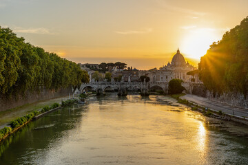 St. Peter Cathedral in Vatican, Rome. Tiber River, Sant'Angelo Bridge, Sunset.