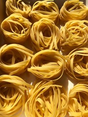 Tagliatelle pasta in a white box macro