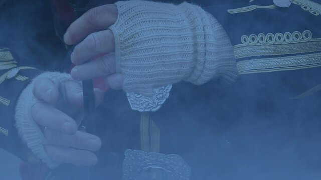 Man Playing The Bagpipes In Smoke At Dusk