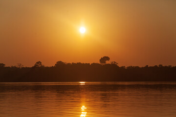 Sunrise on Amazon forest river