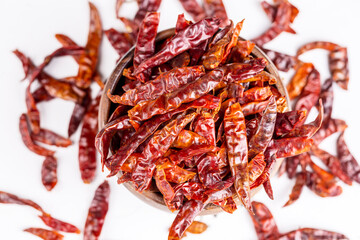 Dried red hot pepper on the white background