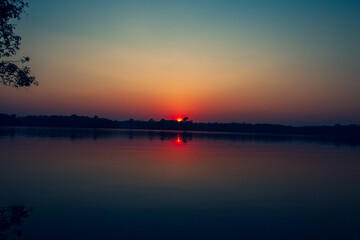 Sunrise on Amazon forest river
