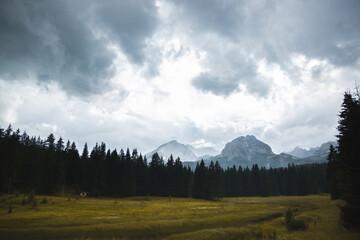 Beautiful landscape with a black stripe and a high rocky mountain in montenegro after the rain and with clouds