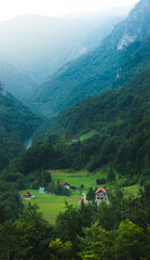 Houses at the foot of huge mountains, vertical panorama, wallpaper, montenegro
