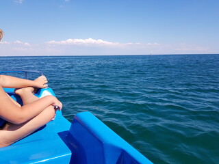 Child on a catamaran in the open sea