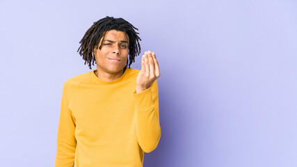 Young black man wearing rasta hairstyle showing that she has no money.