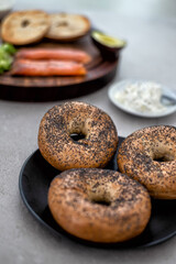 Ingredients for a salmon lox bagel arranged on a table