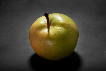nashi pear isolated on black background