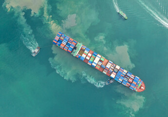 Container , container ship in export and import business and logistics. Shipping cargo to harbor by...