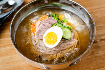 korean style cold noodle in silber bowl