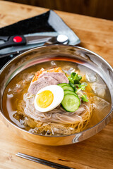 korean style cold noodle in silber bowl