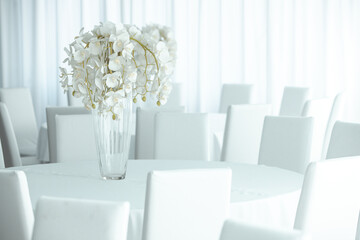 Empty restaurant luxury interior background. Empty chair and table inside room photo. White restaurant interior.