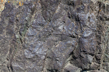 Close-up texture of the stone, sanded and smooth gray with a purple tint. Background for wallpaper, post or illustrations in social networks.
