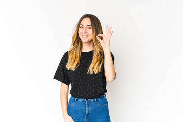 Obraz premium Young caucasian woman isolated on white background cheerful and confident showing ok gesture.