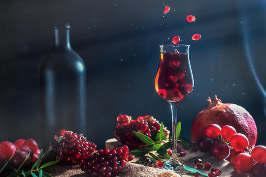 still life pomegranates and pomegranate liqueur in a glass