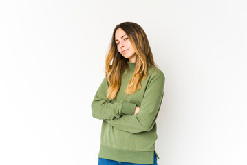 Fototapeta premium Young caucasian woman isolated on white background suspicious, uncertain, examining you.