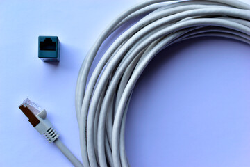 LAN cable patch cord white cord on white background with adapter