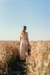 summer girl in a field of wheat