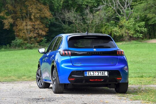Peugeot e208. Electric car in the park. General side view. 09-11-2020, Prague, Czech Republic.