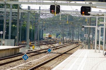 Many railway tracks and a incoming train near station Arnhem central, Netherlands