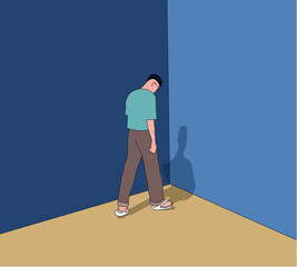 Unhappy Young man stand in front of a wall looking down feeling bad, hopeless, depressed, frustrated and repressed.Unemployment after covid-19 lock down.