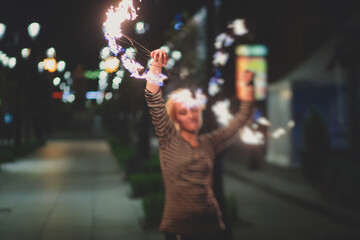 Group of fire artists fakir perform amazing show at night with flamethrowers, fire dancers, chain...