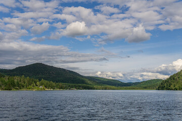 Paul Lake Summer time with green mountains and white clouds british columbia canada.